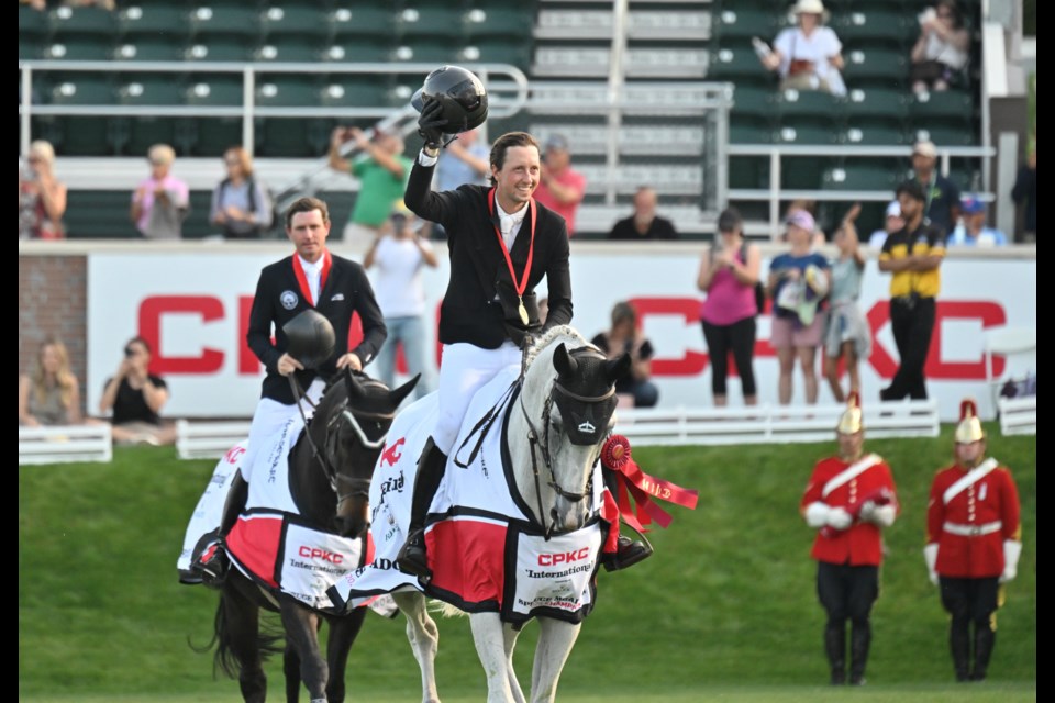 Switzerland showjumper Martin Fuchs and Leone Jei take a victory lap after winning the CKPC ‘International’, presented by Rolex at the Spruce Meadows Masters tournament on Sept. 8 in Foothills County. (Spruce Meadows Media/Mike Sturk)