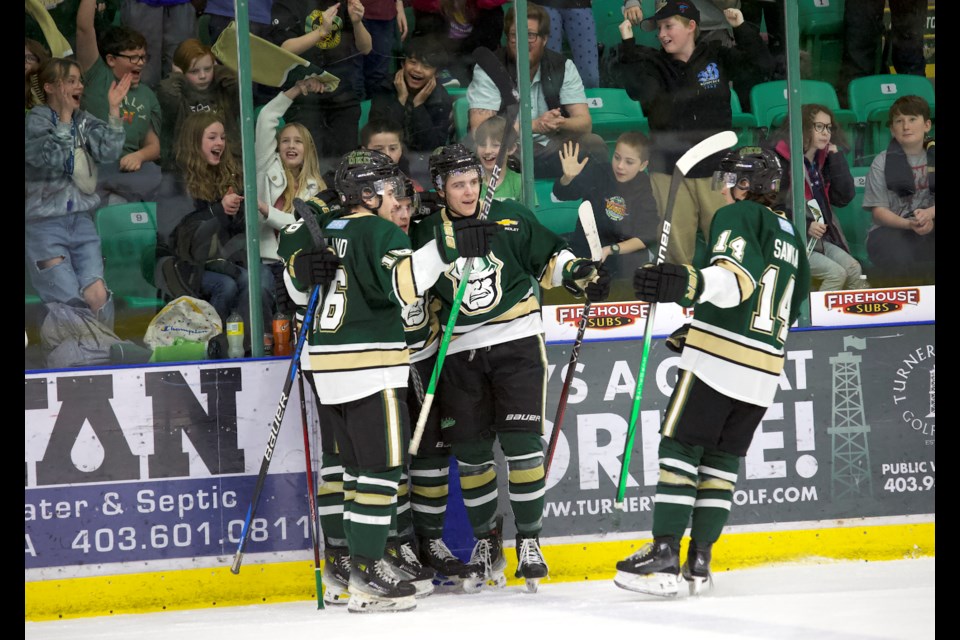 The Okotoks Oilers celebrate Brock Souch’s second goal early in the third period in the 6-2 win over the Spruce Grove Saints in front 1,512 supporters at the Viking Rentals Centre for the annual Minds Matter Game School Day Game in partnership with the Foothills School Division.