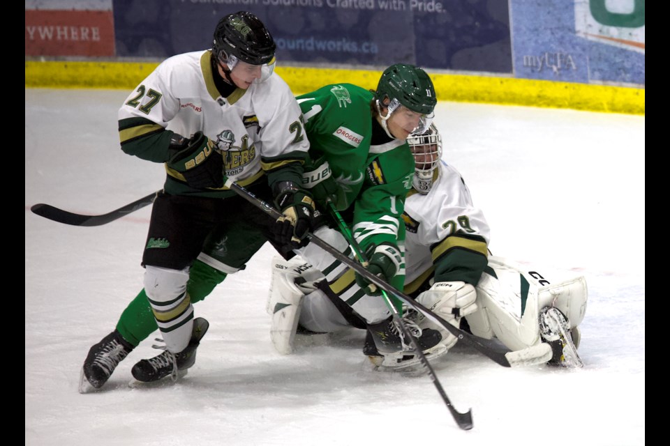 Okotoks Oilers defenceman Brayden Duy and goalie Olivier Ciarlo battle with Cranbrook Bucks forward Samuel Lyne during the Oct. 26 BCHL match at Viking Rentals Centre in Okotoks. Cranbrook won 3-0. 