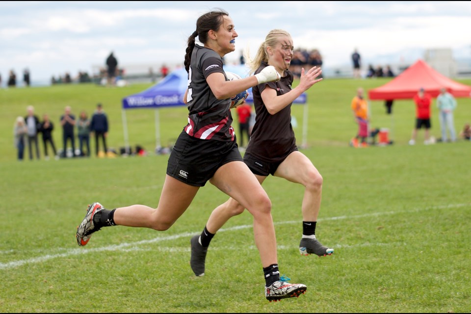 Ciera Schmirler finds open field for the Foothills Falcons first of three tries in the 15-10 victory over the Raymond Comets in the ASAA Provincial Rugby Sevens Tier I Girls Provincial final on June 1 at the Calgary Rugby Union.