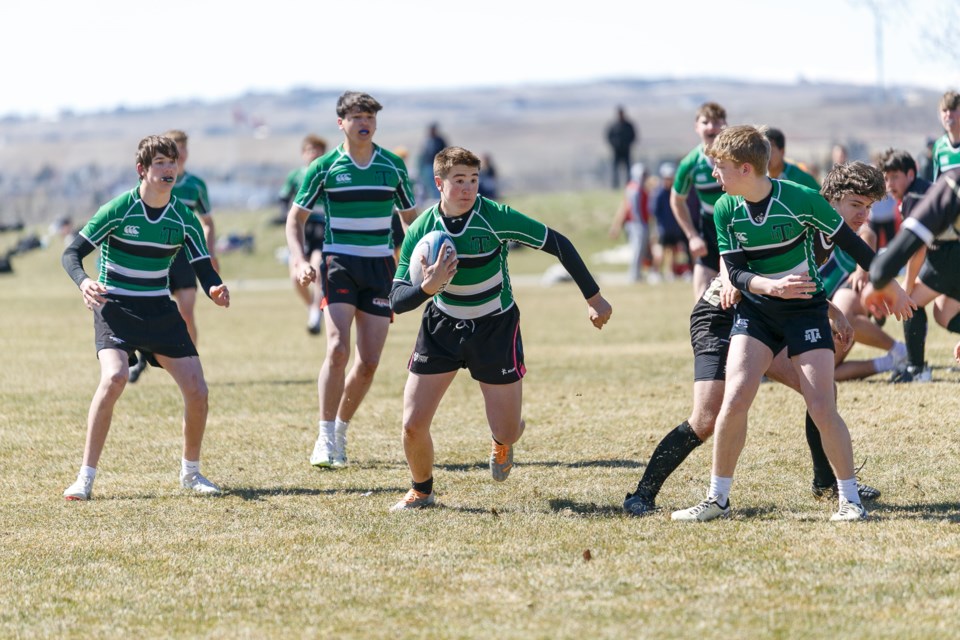 Tony Bews of the Holy Trinity Academy Knights finds open field earlier this season. The Knights won the ASAA Tier I boys rugby provincial title on June 8 in Red Deer. 
