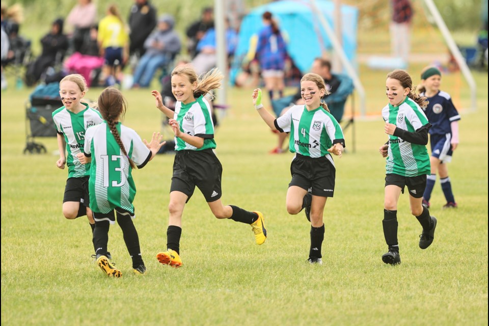 Capri McEwan of the Okotoks United U12 Tier 3 girls plays in the Okotoks United Soccer Jamboree in June 2023.