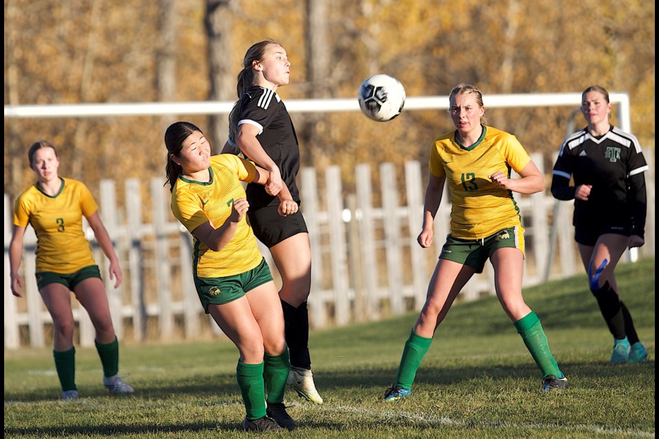 Holy Trinity Academy Knight Lainey Fischer battles in the air during a corner against the Canmore Wolverines in the Foothills Athletic Council final. Canmore won the league final 2-1, with HTA avenging the loss with a victory at the South Central Zone tournament at Springbank en route to a silver medal finish.