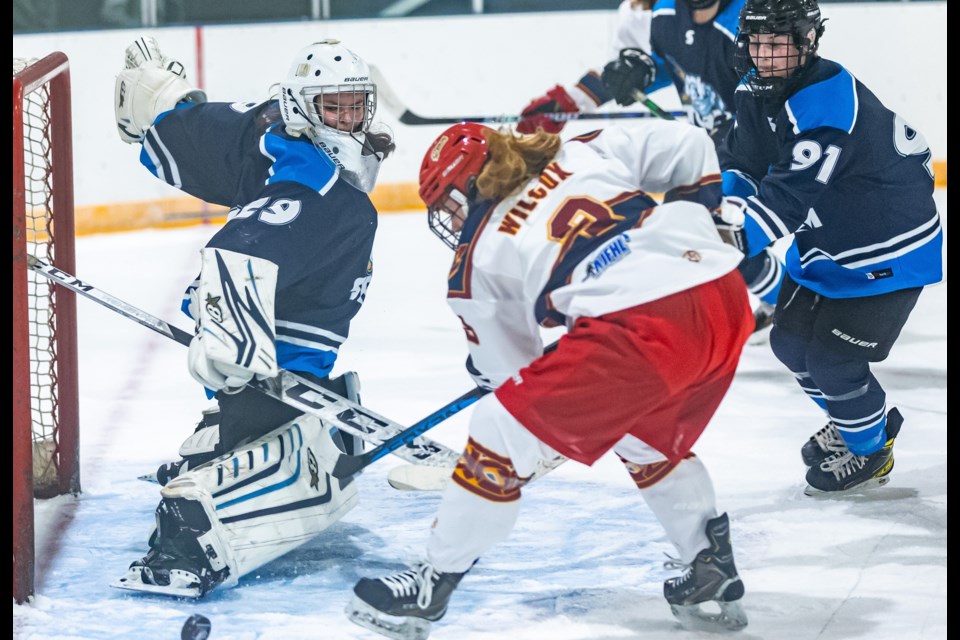 Foothills Storm goalie Paige Williams stretches out for a save versus the Cochrane Chaos during the 2023-24 season in the Alberta Junior Female Hockey League. 