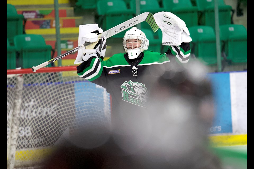 Rocky Mountain Raiders goalie Maren Evans celebrates the gold medal win at the final buzzer during the gold medal game of the U13 AA division at the 2024 Okotoks Female Hockey Classic on Nov. 17 at the Viking Rentals Centre. The Raiders won the final by an 8-0 score.