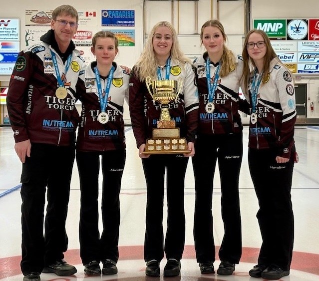 Team Yurko poses after winning the Alberta Optimist U18 Girls Provincial Curling Championship on Jan. 6 in Leduc. From left: coach Glenn Ector, lead Kendra Koch, second Abigail Mielke, third Reese Morison and skip Alena Yurko, from Okotoks. 