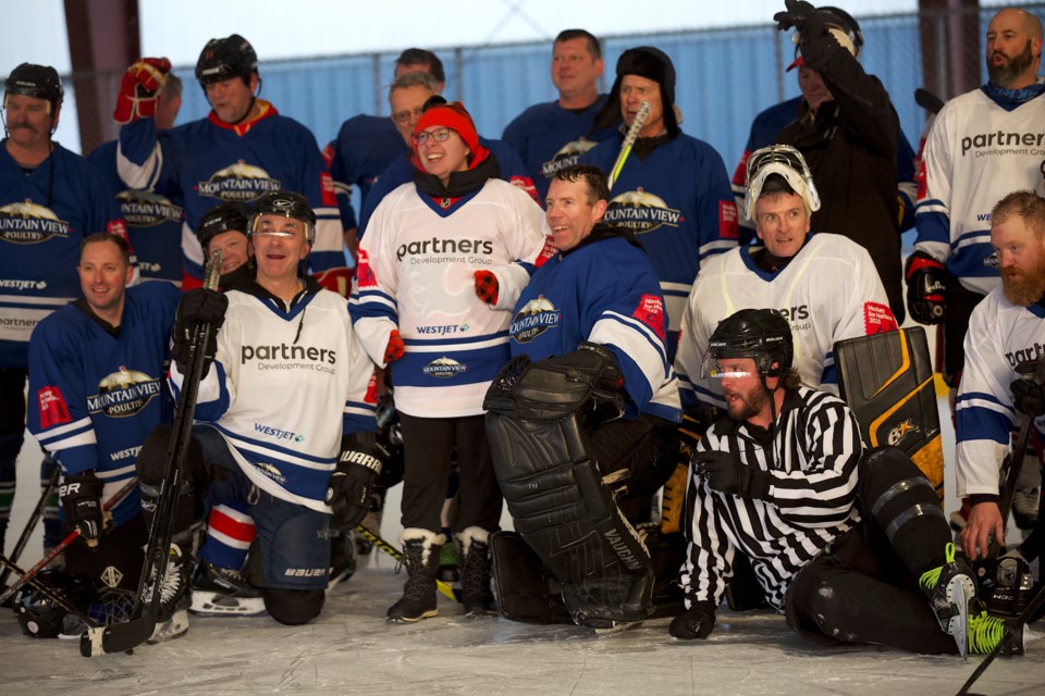 Participants pose following the second annual Hockey for Horizon game which took place on Feb. 8 at the Scott Seaman Sports Rink in Diamond Valley. 