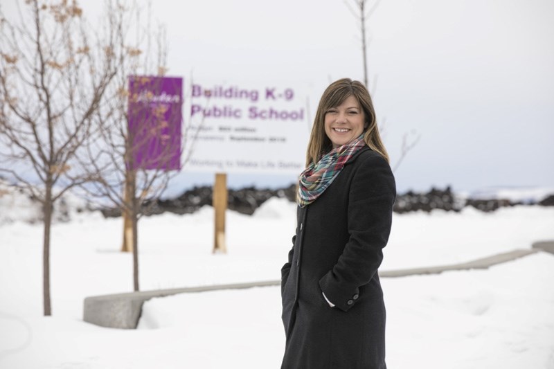 Rebecca Forchuk at the future site of the new K-9 school on 32 St. in Okotoks on March 24. Forchuk has been named as the new principal for the school.