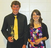 Oilfields High School Athlete of the Year award winners Jessie Elliot (right) and Coltin Berard (left) pose with their trophies at Oilfields High School on Friday night.