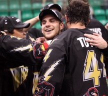 Whitby&#8217;s Mark Cockerton, middle, celebrates the Warriors victory with Chad Tutton, right. Whitby beat Coquitlam 12-7 to win the Minto Cup Aug. 28 at Centennial Arena.