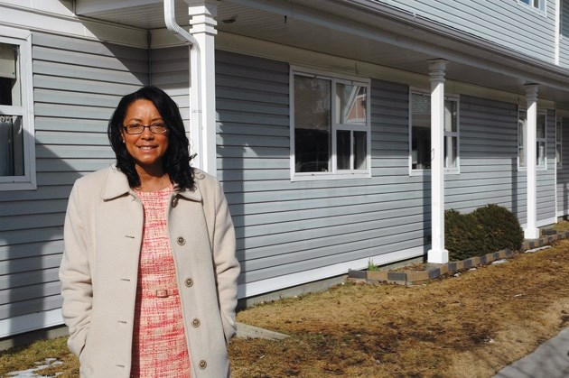 Foothills Foundation CAO Lauren Ingalls stands outside the Medicine Tree Manor in High River, which will see some upgrades thanks to provincial funding.