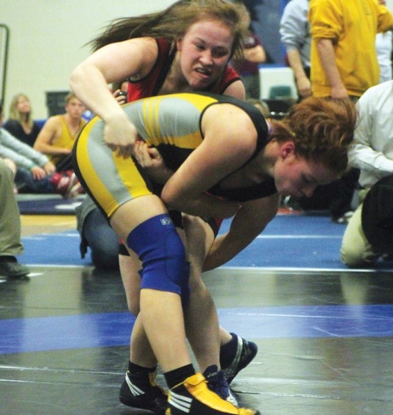 Abi Watkins, here throwing an opponent at the rural provincials in High River earlier this year, will wrestle at the Pan Am Wrestling Games in Medellin, Columbia later this