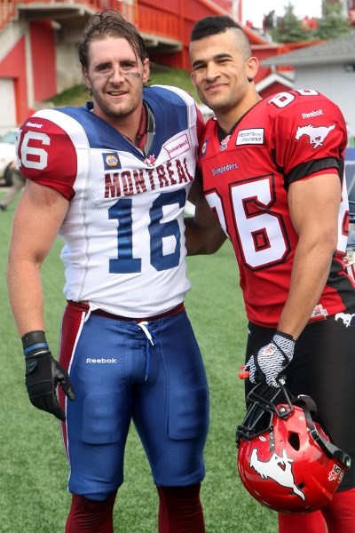 Former Foothills Falcons Bryn Roy, of the Montreal Alouettes and Calgary Stampeder slotback share a moment after the two teams squared off against each other Saturday at