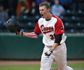 Okotoks Dawgs Connor Crane celebrates scoring a run against the Lethbridge Bulls at Seaman Stadium in August.