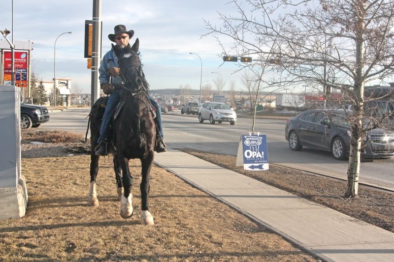 Alberta Outlaw rides Drifter along Southridge Drive on Jan. 31. The Grand Prairie man aims to ride to the southern U.S. to raise awareness around mental health.