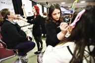 Kendall Lutwick and Bronwen Summers of The Cactus Club Salon and Spa perform a makeup demo on clients. The popular event is returning to the Okotoks Recreation Centre on