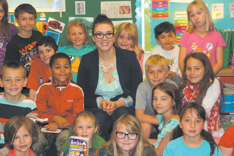 Big Rock School Grade 2/3 teacher Katlin Strand is surrounded by her students on May 27. Strand was one of the six provincial recipients of an Edwin Parr Award for