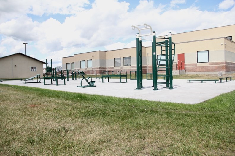 The new stationary-equipment outdoor fitness park, installed at St. John Paul II Collegiate in July, is accessible to the public.