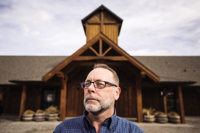 Millarville Community Church pastor Allan Burney stands outside the church on Mar. 5. The church is sponsoring an Iraqi refugee family of three through the First Alliance