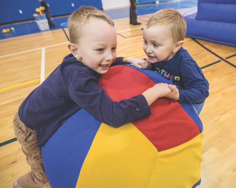 Archie Shearer, 6, and brother Charlie, 4, play with a large ball during the Kids New Year&#8217; s Eve Party at the Okotoks Recreation Centre last year. This year&#8217; s