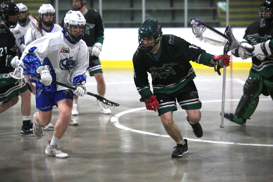 Okotoks Marauders defender Colton Jones grabs a loose ball versus the Lethbridge Barracudas in the RMLL regular season finale for both teams on July 16 at the Murray Arena. Okotoks won 15-8 to finish the season with a record of 11-8-1.