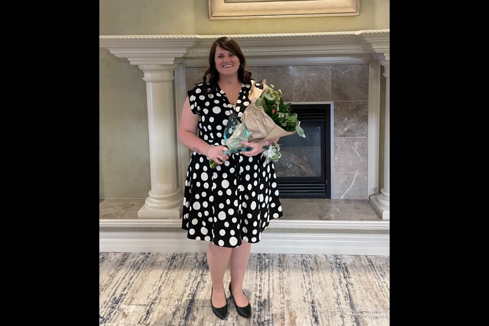 Amy Lewis poses with her Woman of the Year award after being selected for the prestigious honour at Wednesday night's event at the Best Western Plus Mariposa Inn and Conference Centre.