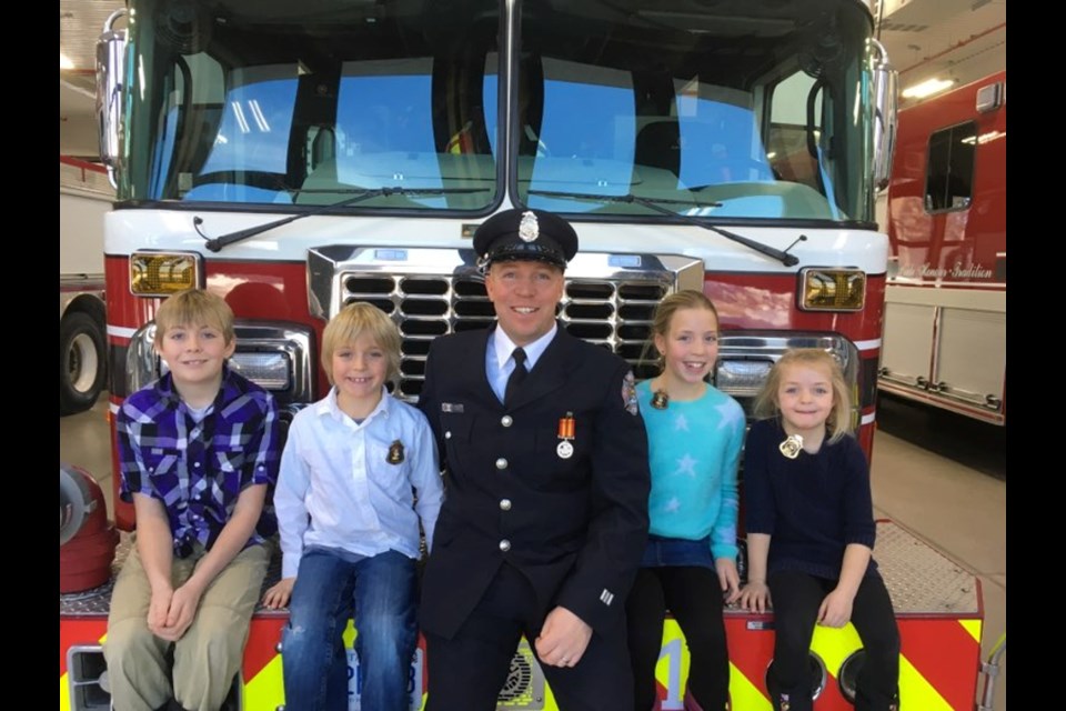 Rob Ferguson, pictured with his four children, served in Severn and Orillia over a 26-year career as a firefighter.