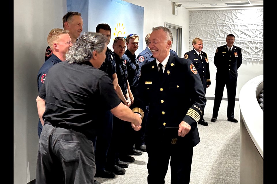 Orillia's fire chief, Michael Clark, was honoured for his four decades of service at Monday's council meeting, where he shared smiles with his colleagues.