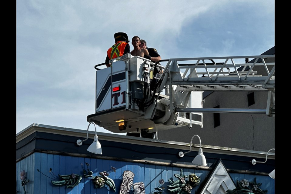 Orillia OPP and Orillia Fire worked together this afternoon to remove a man from a downtown Orillia rooftop. 