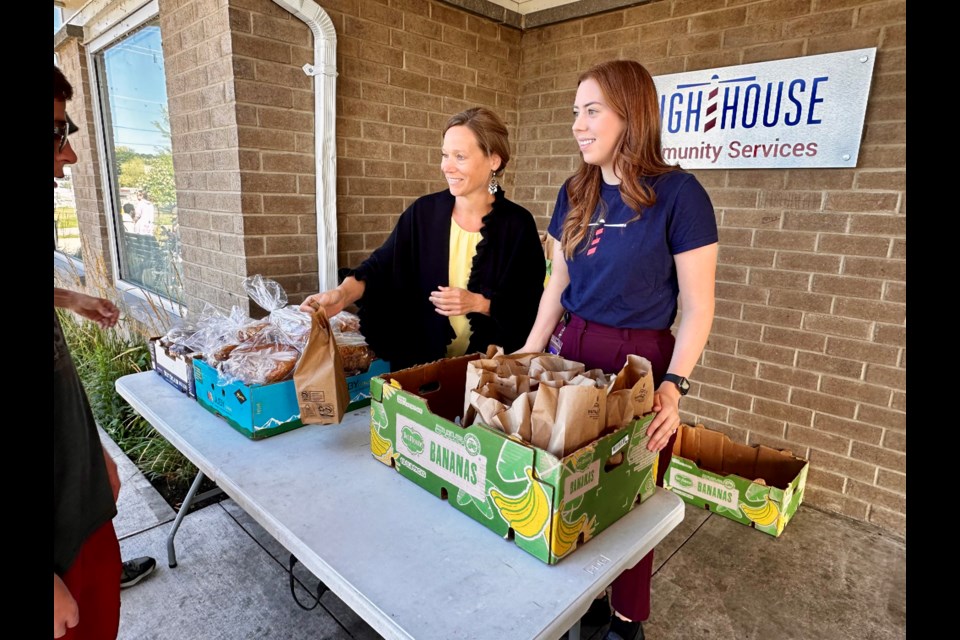 The Lighthouse has nearly doubled the amount of meals handed out through its bagged lunch program on the strength of a provincial grant. Pictured are Leslie Stroud, constituency assistant to Simcoe North MPP Jill Dunlop, left, and the Lighthouse’s Meagan Bianco.