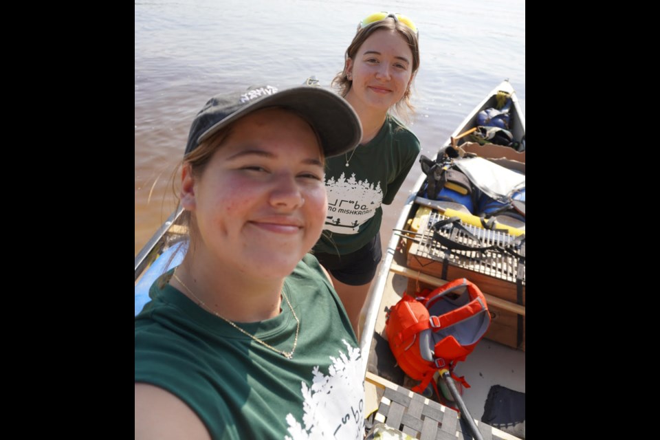 Mackenzie Taylor, front, and her sister, Avery, recently took a week-long canoe trip through the Moose Cree Homeland with a dozen Moose Cree youth from around Ontario.