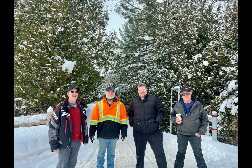 Orillia District Snowmobile Club members and volunteers help make sure trails are in tip-top shape for snowmobilers. From left: Club president Rob Love, vice-president Jeff Soley, Jason Lee and Rick Sider stand on the trails off of Division Road.