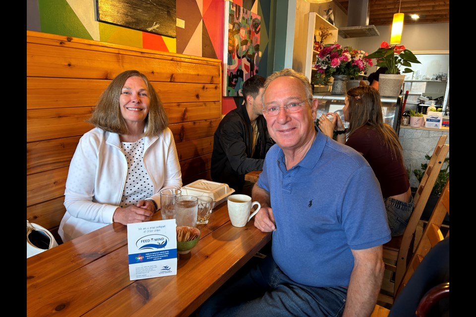 Karen Baldock and Geoff Waters are shown at 125 Breakfast Club, which is participating in the Feed the Mind program to help fund CFUW Orillia scholarships.