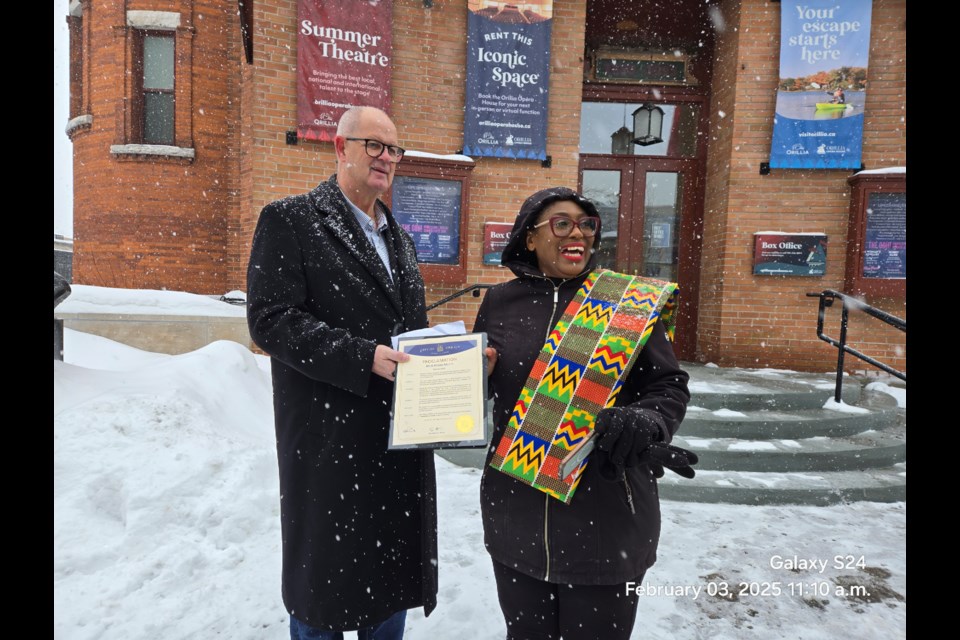 On Monday, several local residents and dignitaries braved the cold and snow to attend the raising of the Pan-African flag in front of the Orillia Opera House. Above are Orillia’s mayor, Don McIsaac, and the organizer of the event, Alasoba Kelsy-Braide.