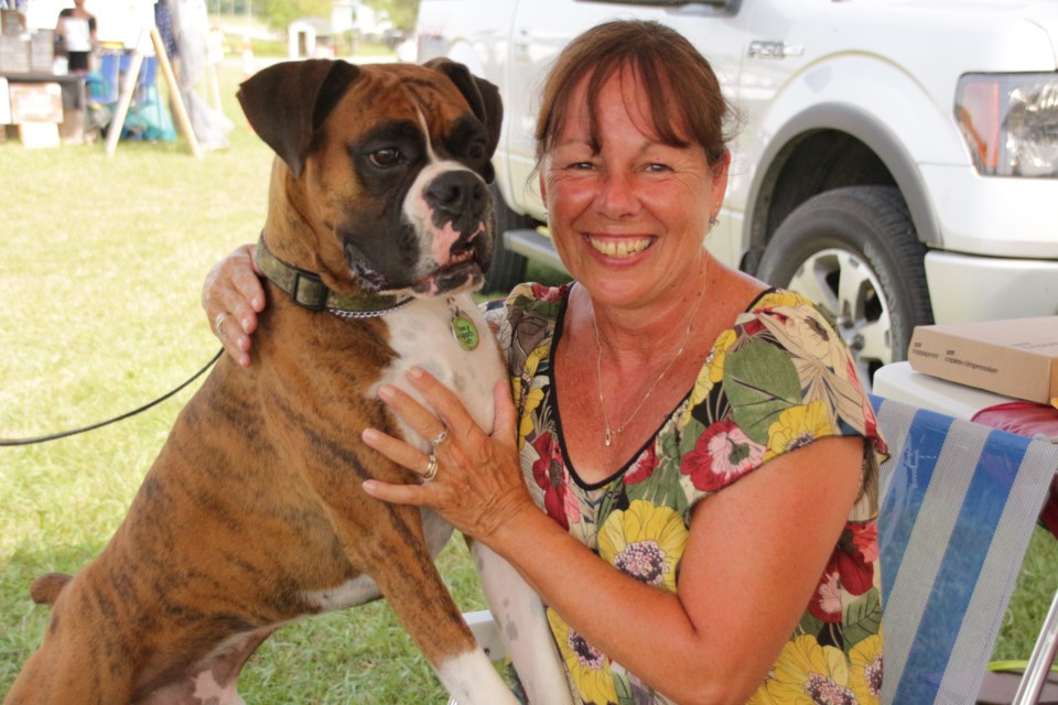 Chieftan’s Hit the Jackpot, aka Vegas, gives Laura Belisle a hug after completing his Canine Good Neighbour test at the Barrie Kennel and Obedience Club event at ODAS Park. Mehreen Shahid/OrilliaMatters