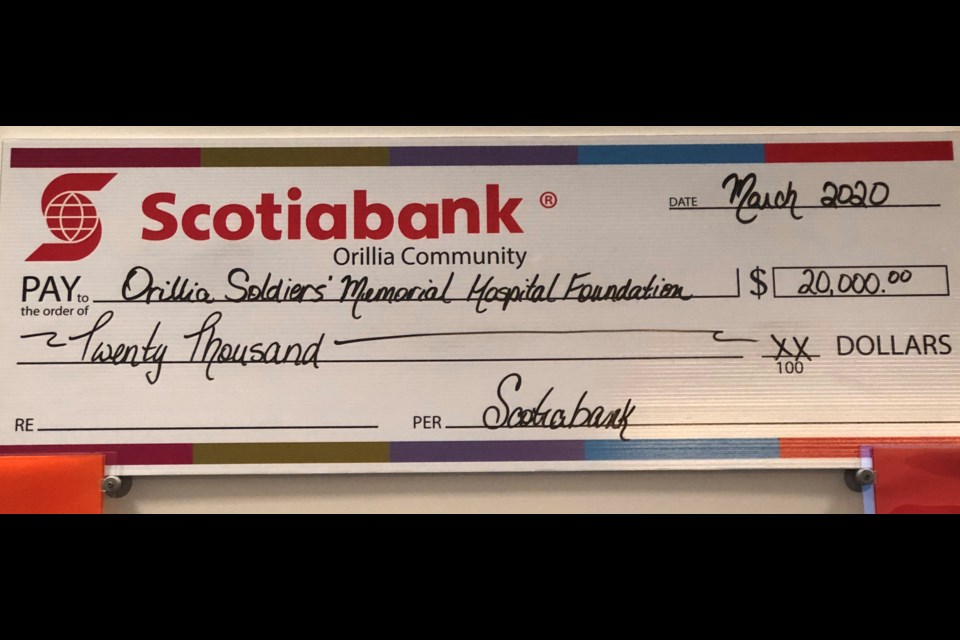 Due to social distancing and COVID-19 prevention precautions, Leona Beasley and Amy Speers, Scotiabank Branch Managers, present a photo of their large cheque to Orillia Soldiers’ Memorial Hospital Foundation.