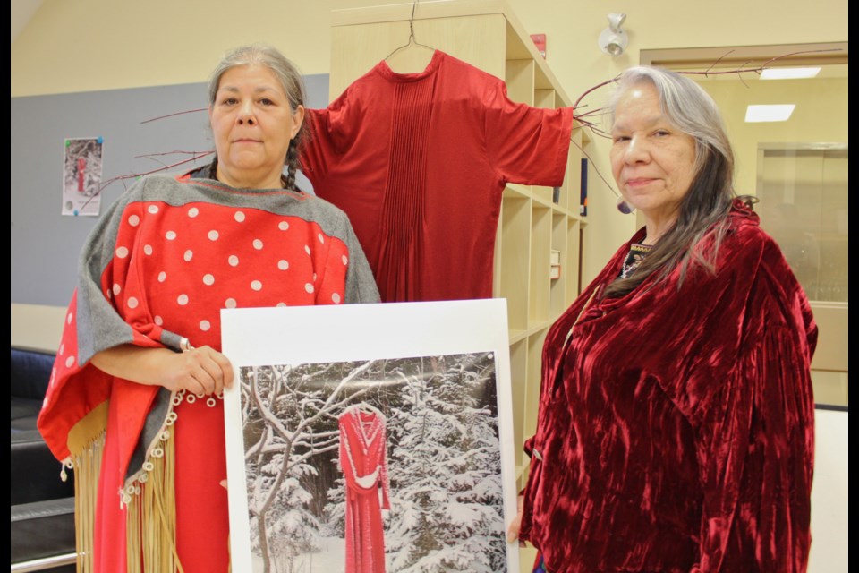 Becky Big Canoe, left, and Dawn Ireland are shown Friday during the launch of the REDress Project installation at the Orillia Museum of Art and History. Nathan Taylor/OrilliaMatters