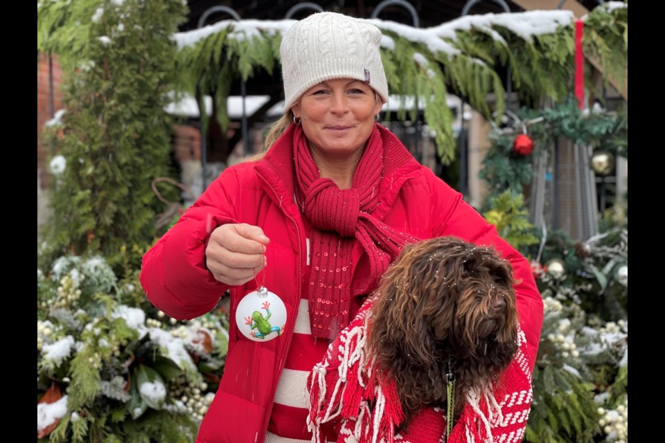 Tracy Tupling and her dog, Lucas Wagner, attended the  Merry Streets Alive Christmas event on Saturday morning. 