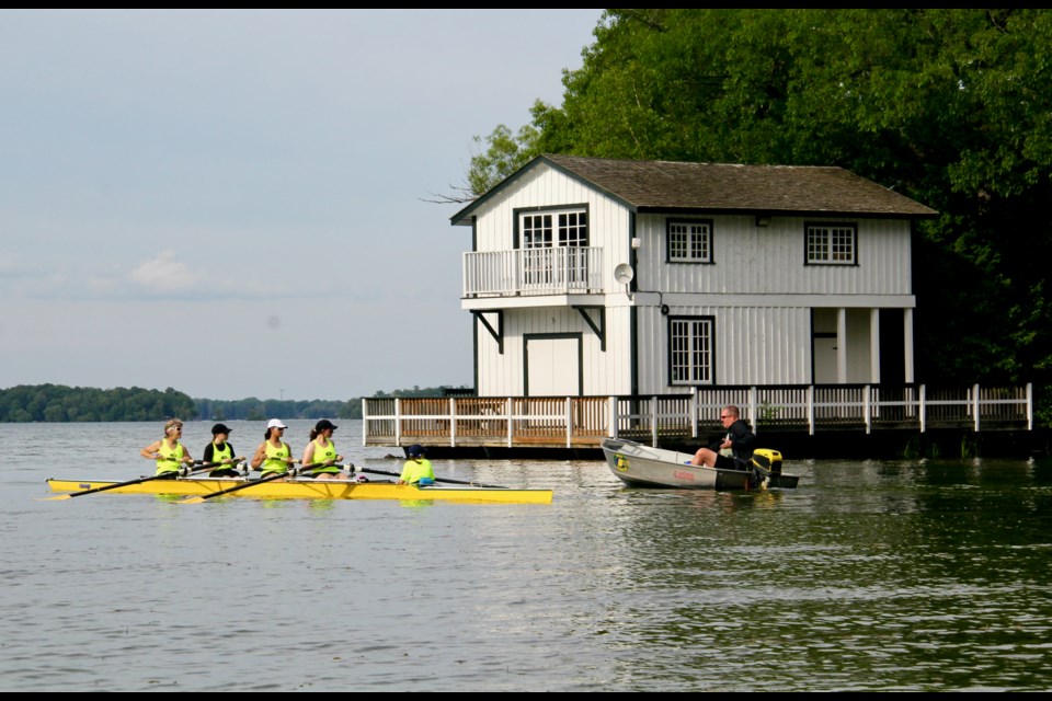 Orillia Rowing Club Coach Scott Allen gives the coxed four-person team instruction on Lake Couchiching.