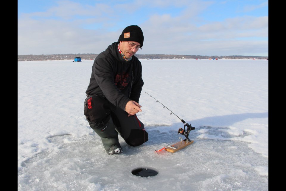 Local father, son hooked on a new addiction: ice fishing - Orillia
