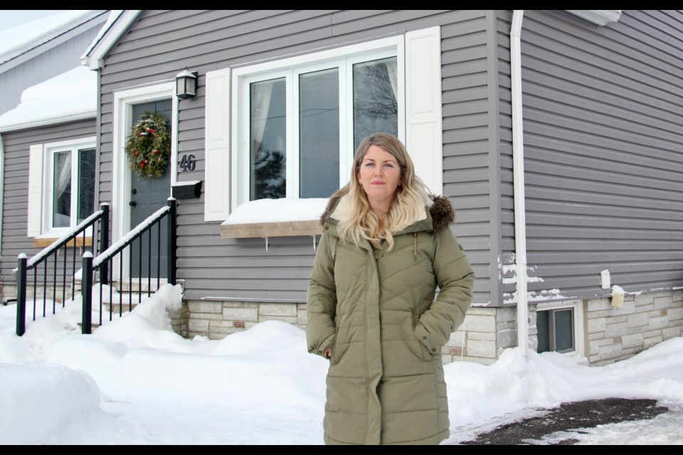 Seen outside her home, Rachel Edwards, of Orillia, says paying the $2,040 licensing fee for her one-bedroom Airbnb is "atrocious."