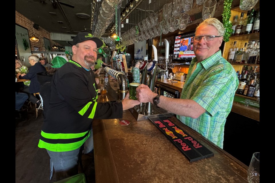 Brewery Bay Food Company founder Steve Clarke served one last beer to loyal customer Aaron Cornelisse this afternoon, just hours before the restaurant's original location permanently closes its doors and moves down the street to Couchiching Craft Brewing Company. 