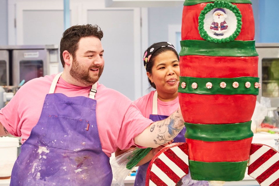 Mark Robillard and Eleanor Roxas from Orillia's Sugar Dessert Bar put the final touches on their rocket ship cake that was chosen by Food Network judges as the winner for ‘The Big Bake’. 