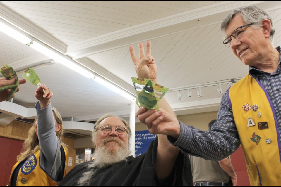 After having his hair cut for charity Monday night, Coldwater Lions Club member Richard Jolliffe upped the ante, calling for $300 in donations to see the beard go, too. That amount was exceeded. Nathan Taylor/OrilliaMatters