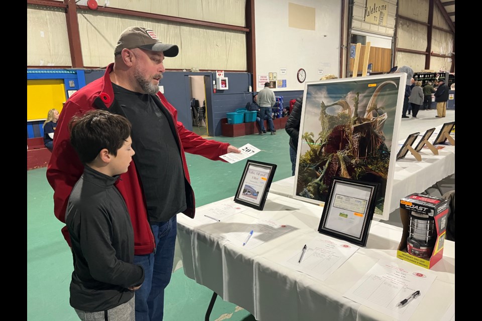 Mike Sirdevan and his son, Nick, are shown at Saturday's Kiwanis Club of Orillia Auction at ODAS Park.