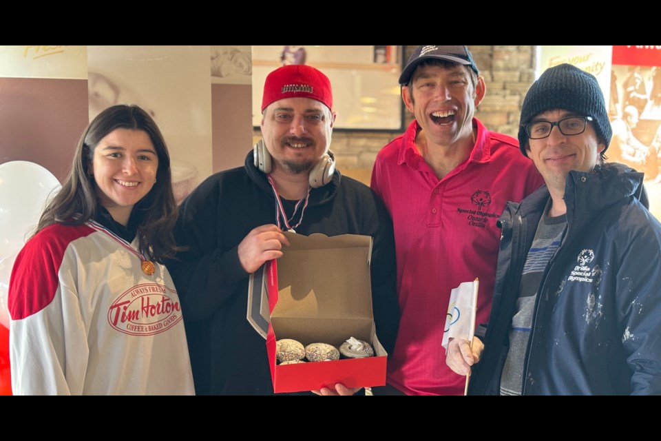 Some of Orillia's Special Olympic athletes decorated this year's signature donut for patrons of the Memorial Avenue eatery. 100 per cent of all proceeds from sales of the donut benefit Special Olympics athletes.