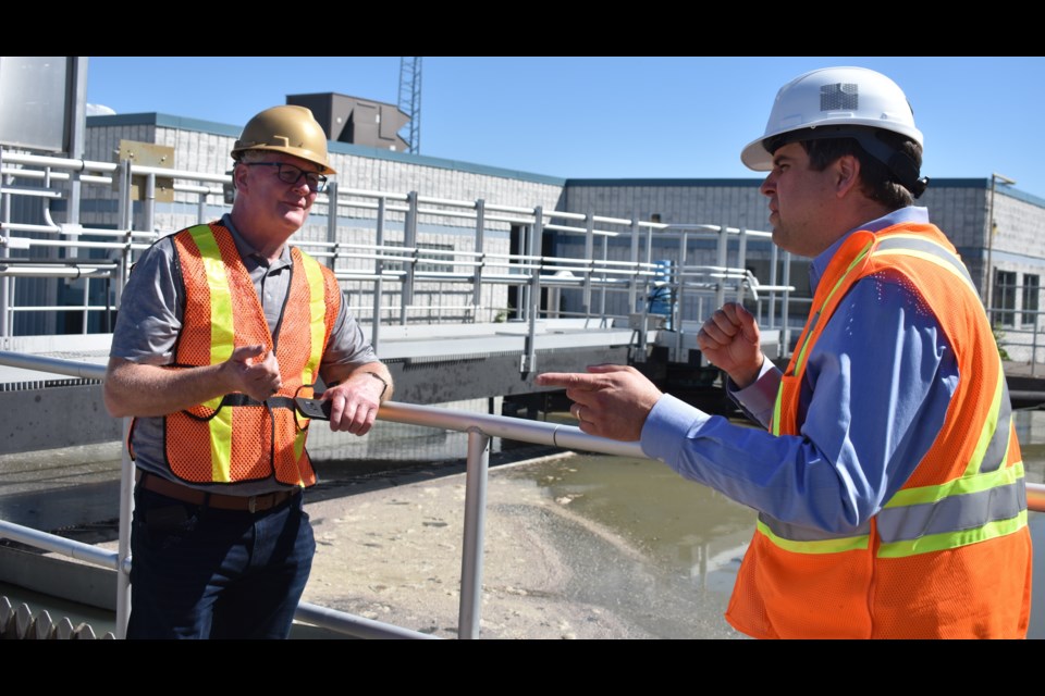 Greg Preston, right, the manager of waste management for the city, explains how waste is treated to members of the media and Orillia Mayor Steve Clarke. Staff gave a tour of the facility to help explain the process and the reason behind recent odours coming from the Kitchener Street facility. Dave Dawson/OrilliaMatters