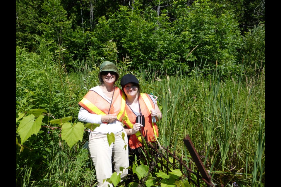 Trudy and her daughter check water quality.