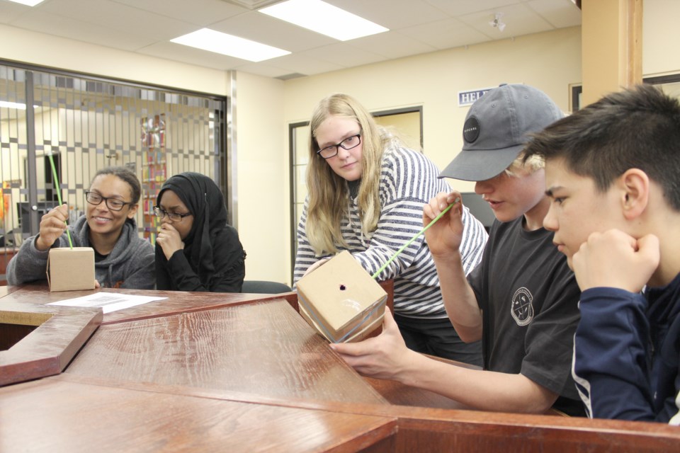 Orillia Secondary School students Tyonna Ashby, left, Isatu Barrie, Kimmie Fitz, Aidan Colebrook and Jacob Man poke around to determine what's in the mystery box. Nathan Taylor/OrilliaMatters