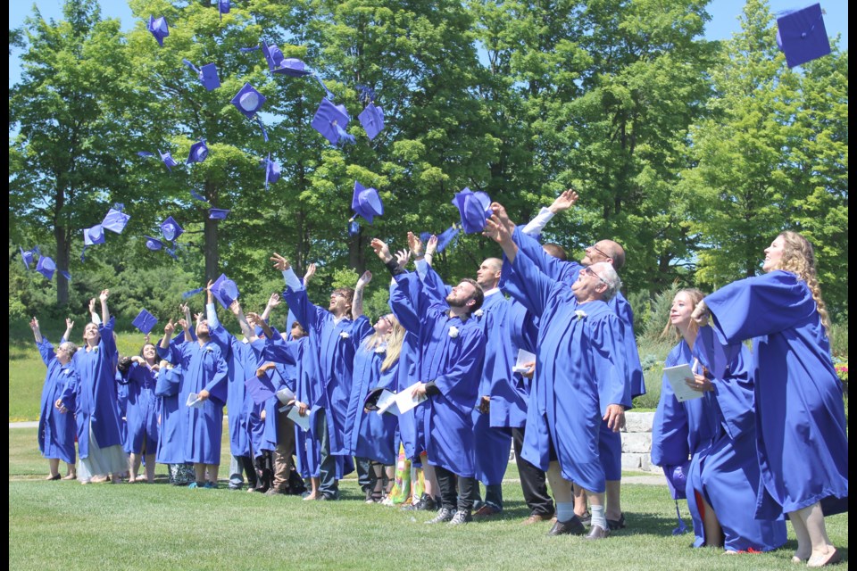 Hats off, grads! Graduates from the Orillia and North Simcoe Learning Centres celebrate after Thursday's ceremony at Hawk Ridge Golf and Country Club. Nathan Taylor/OrilliaMatters